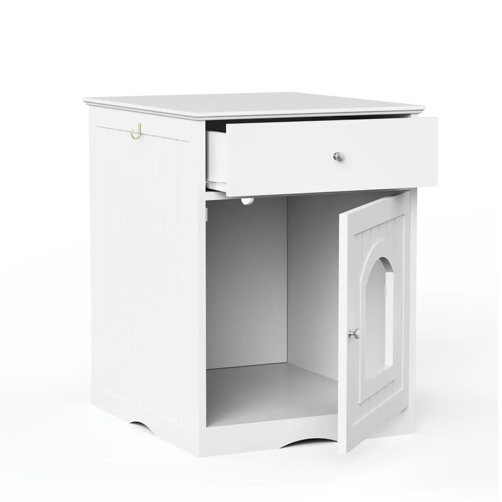 Closed wood-finish cabinet hiding the litter pan with a plant on top