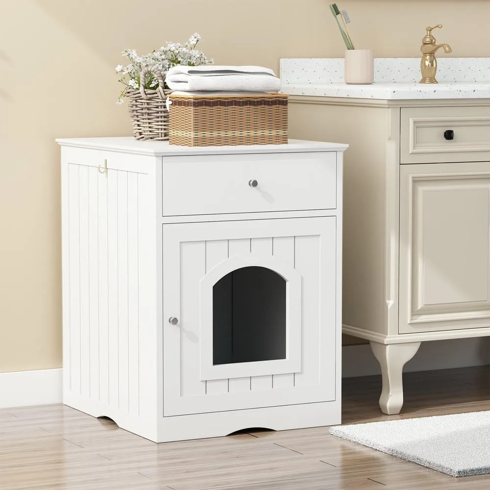 Closed wood-finish cabinet hiding the litter pan with a plant on top