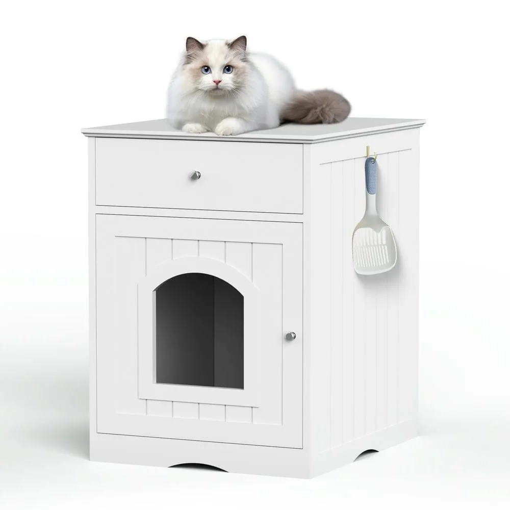 Closed wood-finish cabinet hiding the litter pan with a plant on top