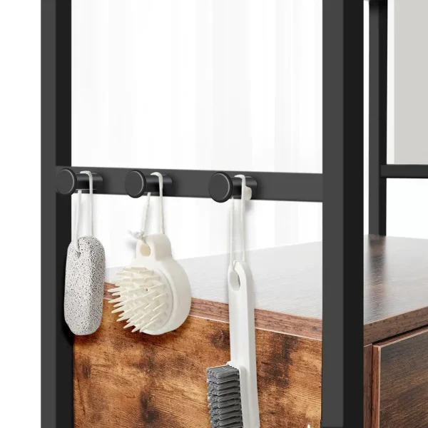 Three side hooks on the dog feeding station holding pet grooming brushes and bath tools