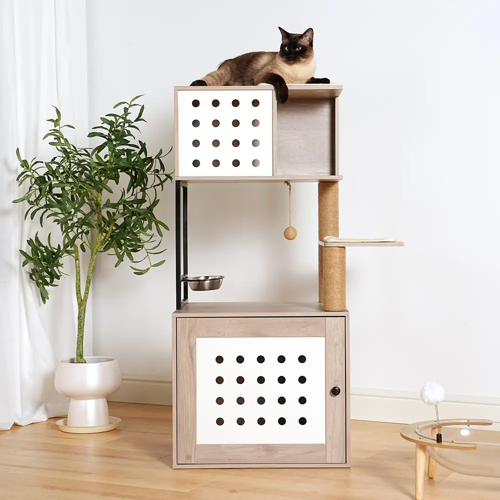 Cat tower litter box in a bright room with a cat resting on the top platform