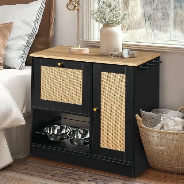 black vintage cabinet styled as a sideboard in a bedroom