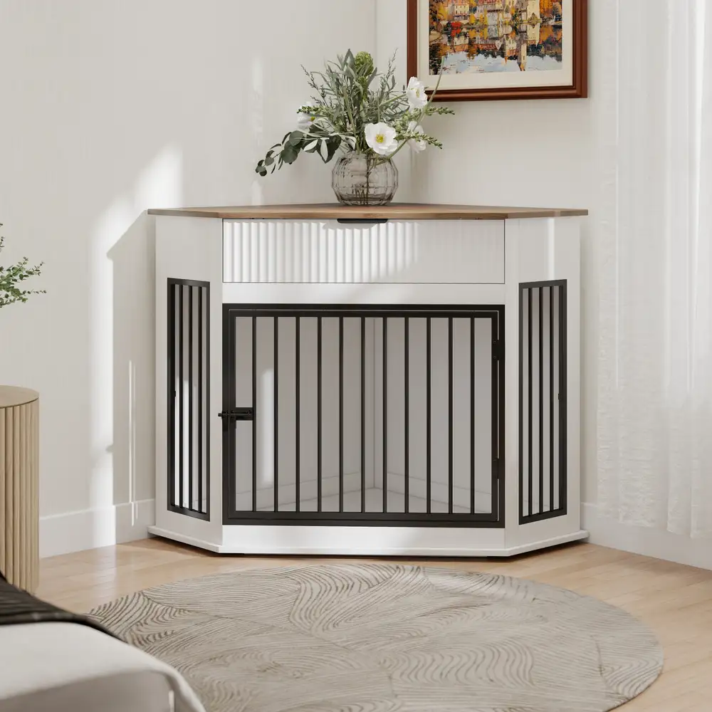 White dog crate styled in a room corner with flowers on top