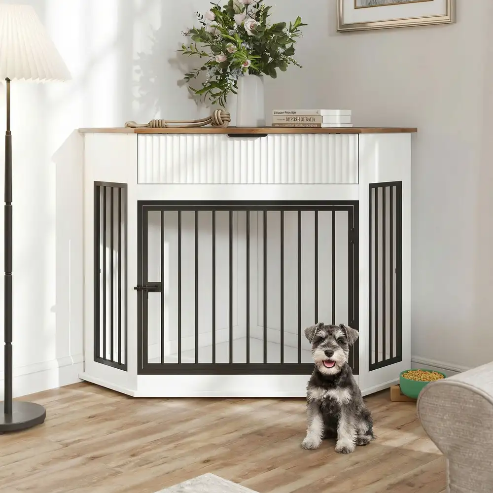 White dog crate furniture with dog sitting in front of the metal door