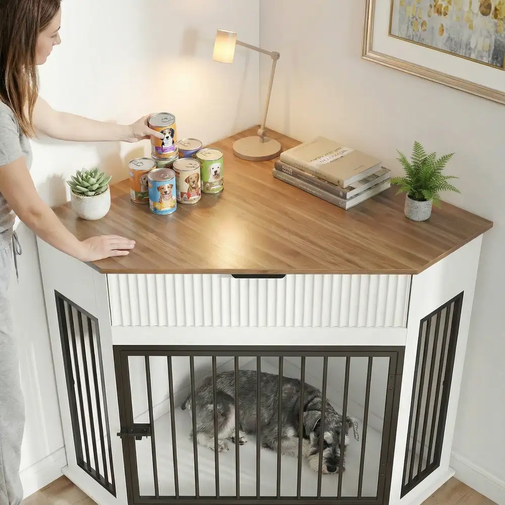 White corner dog crate with storage drawer and dog resting inside